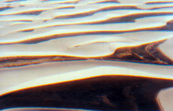 Fotografia colorida dos Lençóis Maranhenses, com dunas e lagoas, extraída integralmente da prova oficial de 2003.